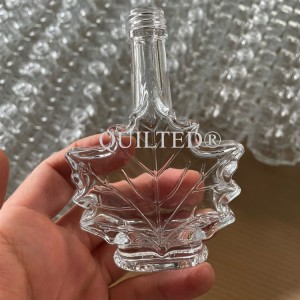 China Maple Syrup Leaf Shaped Empty Glass Bottles 50 ml 100 ml 250 ml Manufacturer and Company | QLT