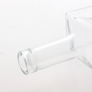 China 700ml clear trapeziod shape glass alcohol bottles Manufacturer and Company | QLT