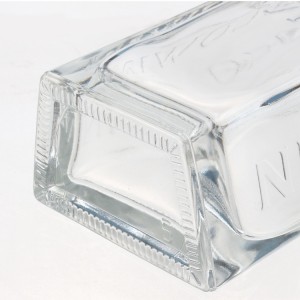 China 700ml fancy clear trapezoidal shape alcohol bottles Manufacturer and Company | QLT