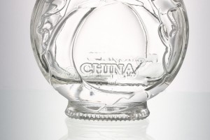 China 300 ml embossed glass bottle for whisky and liquor with lid Manufacturer and Company | QLT