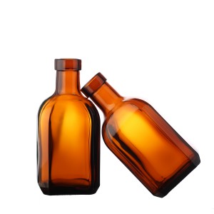 China Custom brown color liquor glass bottle with cork Manufacturer and Company | QLT